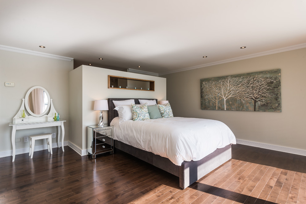 Inspiration for a large contemporary master bedroom in Montreal with beige walls and dark hardwood floors.