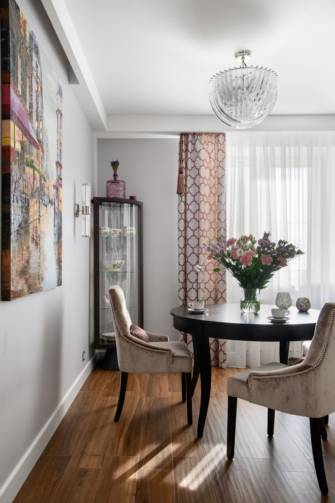 Inspiration for a mid-sized transitional separate dining room in Moscow with porcelain floors and brown floor.