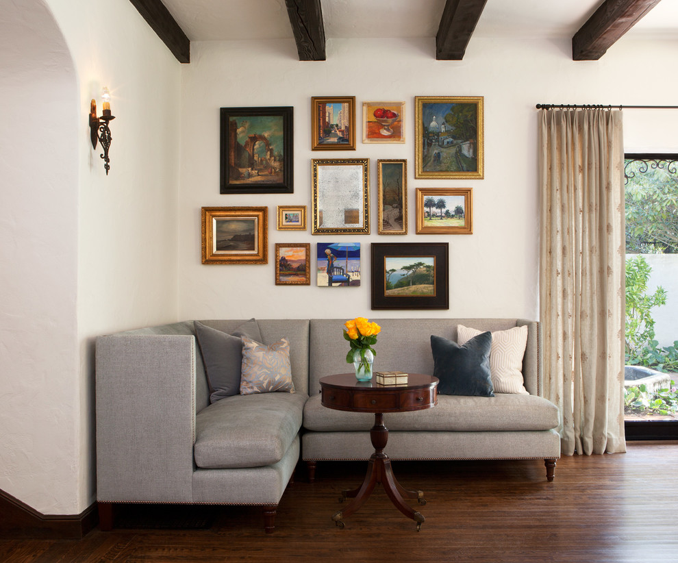 Inspiration for a traditional living room in San Francisco with white walls and dark hardwood floors.