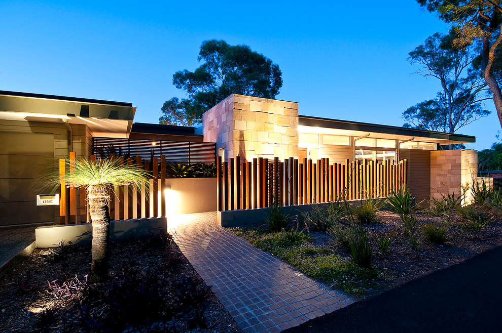 This is an example of a large contemporary three-storey exterior in Sydney.