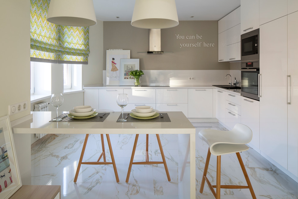 Inspiration for a contemporary eat-in kitchen in Moscow with an undermount sink, flat-panel cabinets, white cabinets, solid surface benchtops, white splashback, stainless steel appliances, marble floors and no island.
