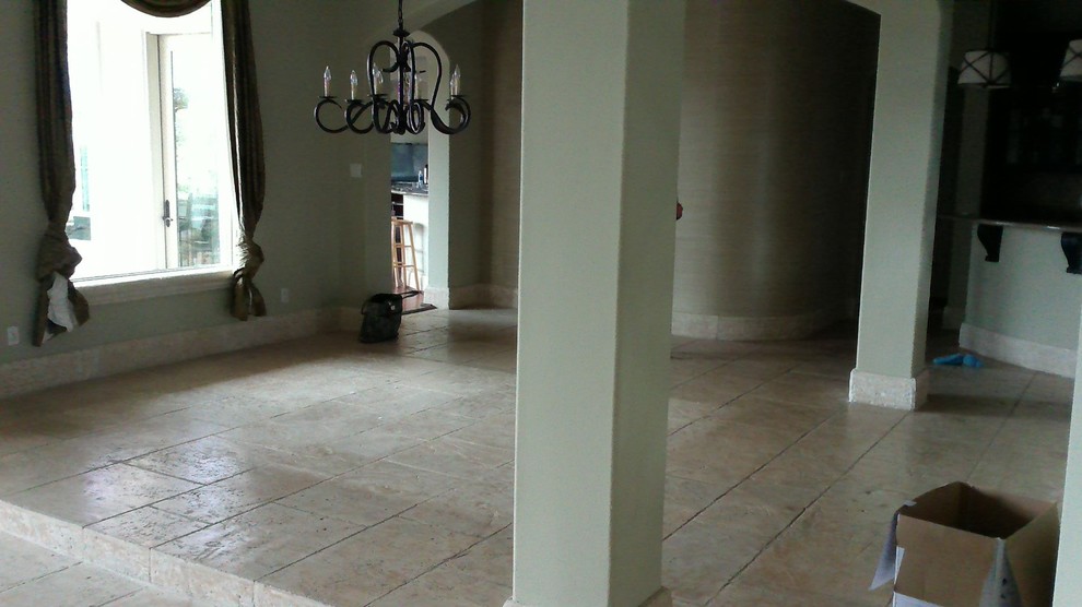 Inspiration for a mid-sized transitional limestone floor dining room remodel in Austin with white walls and no fireplace