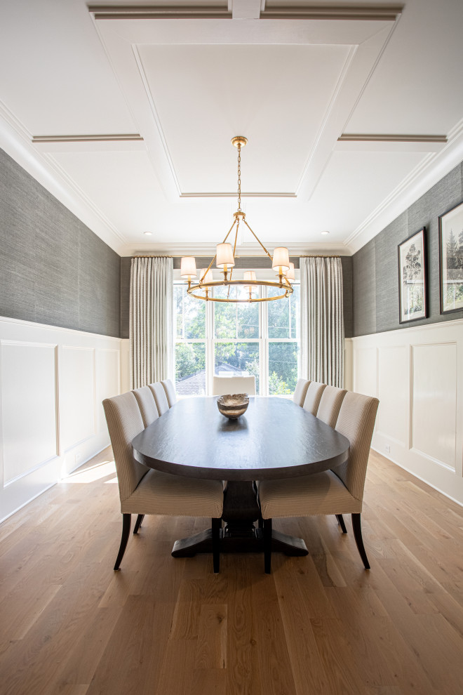 This is an example of a transitional dining room in Atlanta with wallpaper.
