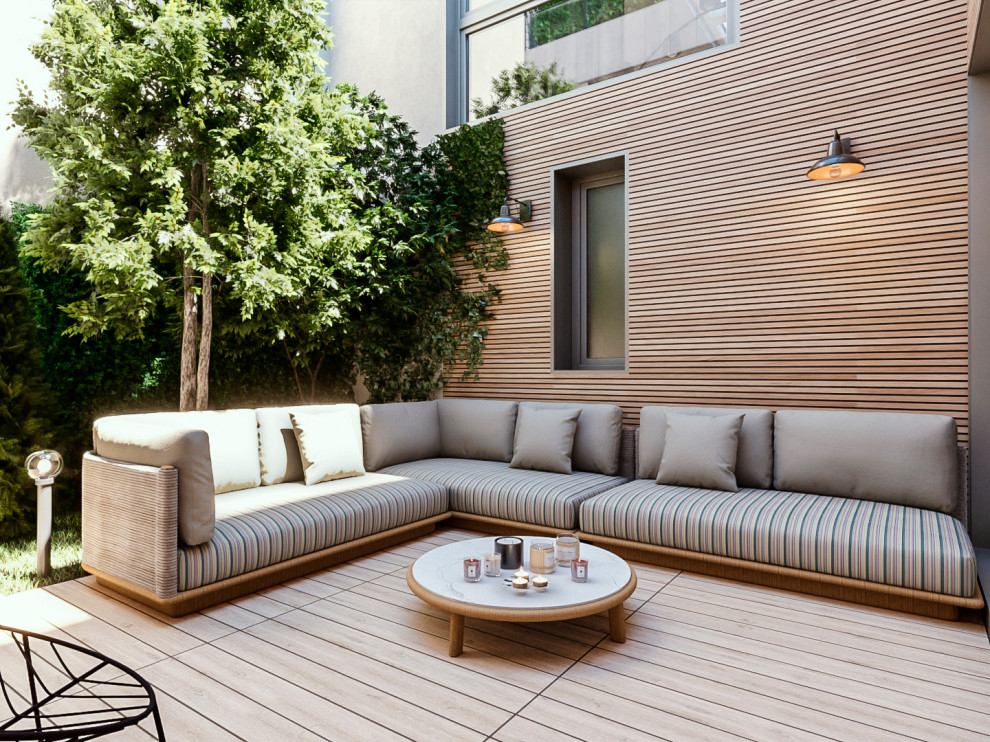 Modelo de terraza planta baja actual de tamaño medio sin cubierta en patio trasero con jardín vertical