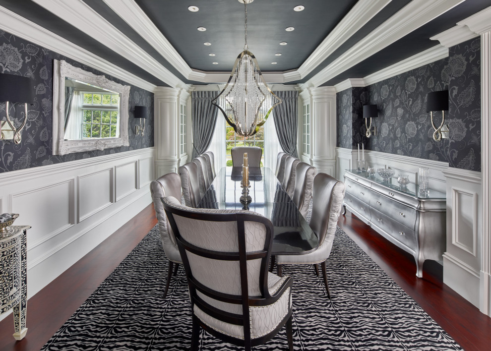 This is an example of a traditional separate dining room in Boston with grey walls, dark hardwood floors, brown floor, recessed, decorative wall panelling and wallpaper.