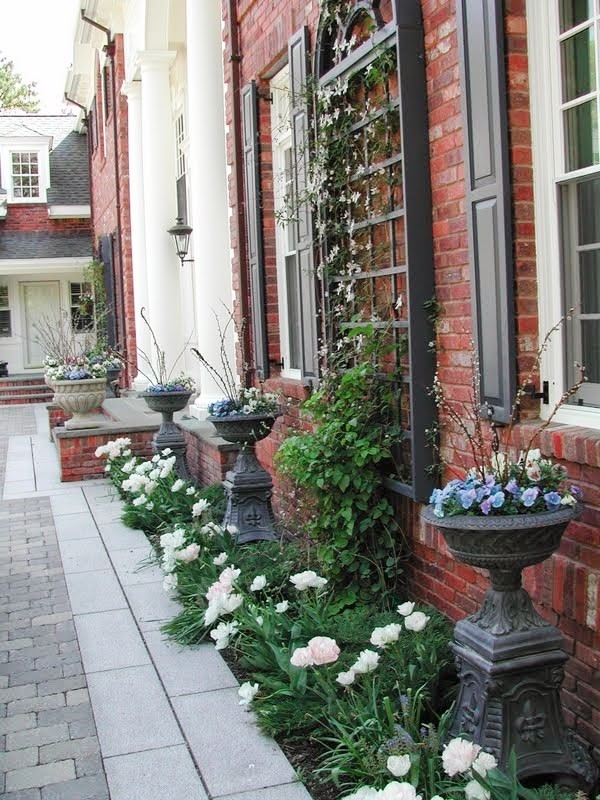 Large traditional courtyard shaded formal garden in Boston with natural stone pavers for spring.