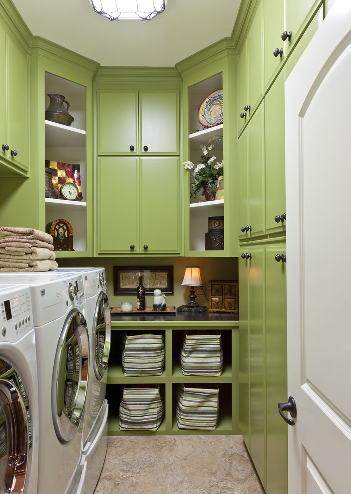 Design ideas for a traditional laundry room in Little Rock with green cabinets and beige floor.