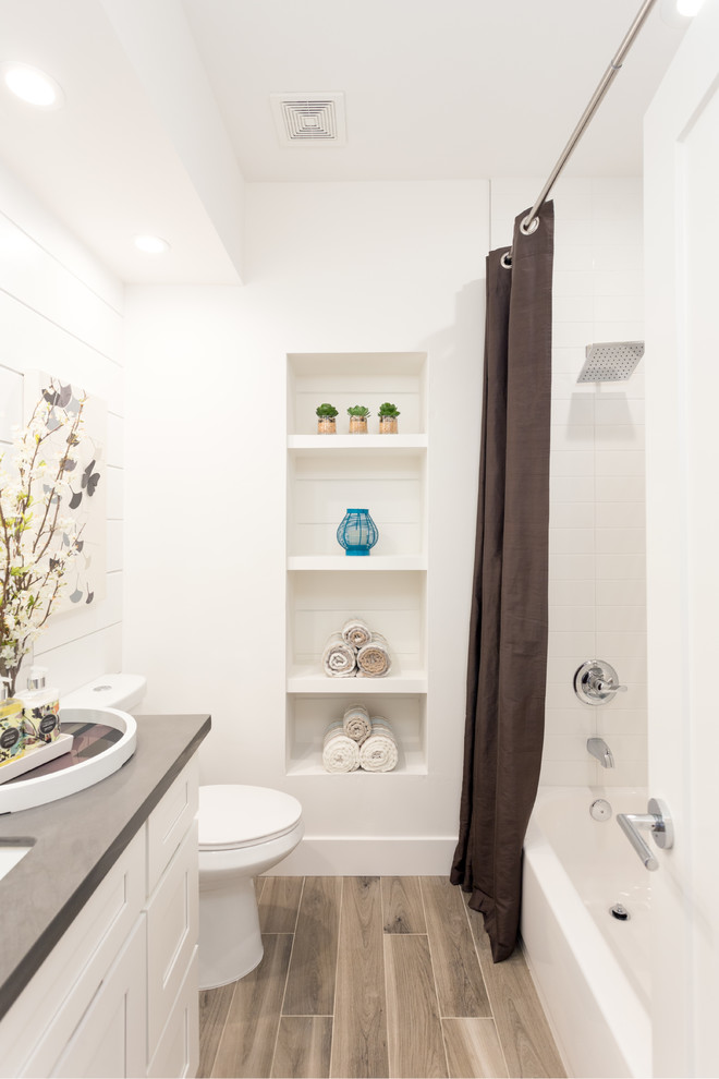 Small transitional bathroom in Phoenix with shaker cabinets, white cabinets, an alcove tub, a shower/bathtub combo, white tile, white walls, an undermount sink, engineered quartz benchtops, ceramic tile and ceramic floors.