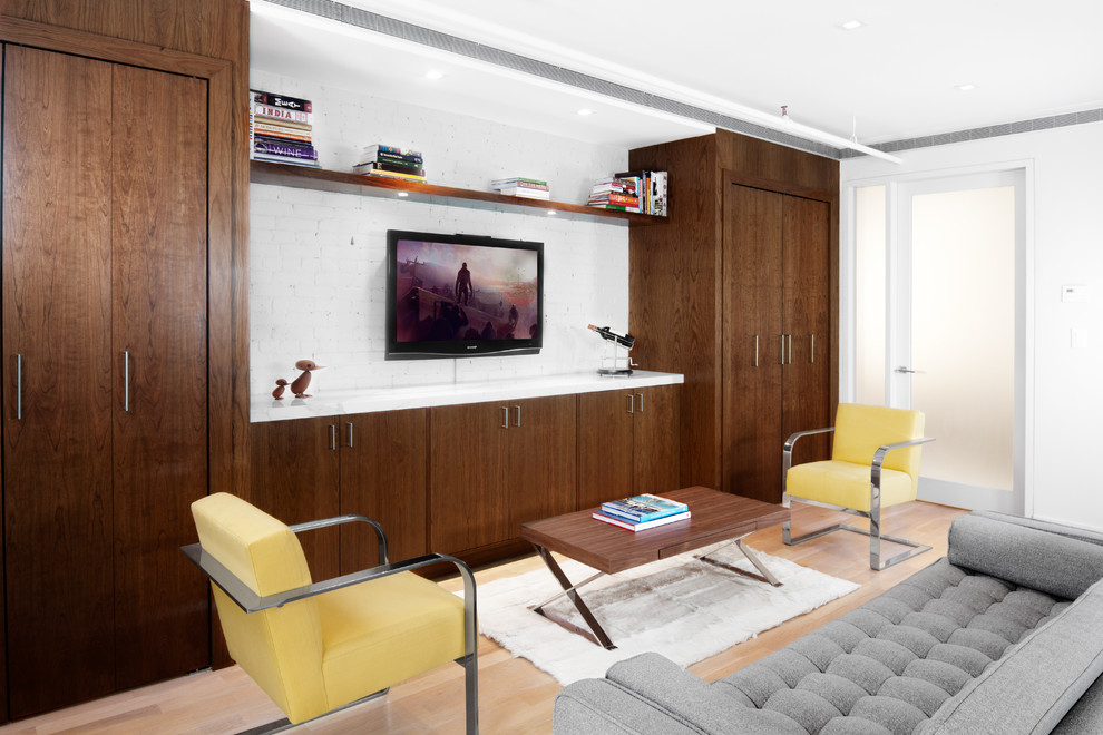 Modern living room in New York with a wall-mounted tv.