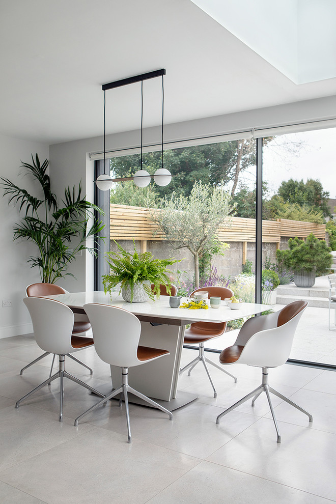 Mid-sized contemporary dining room in Other with white walls.