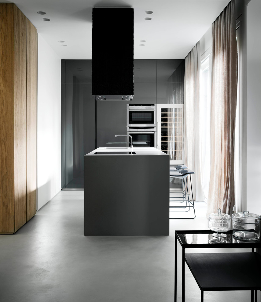 Mid-sized contemporary single-wall open plan kitchen in Rome with flat-panel cabinets, with island, grey cabinets and porcelain floors.