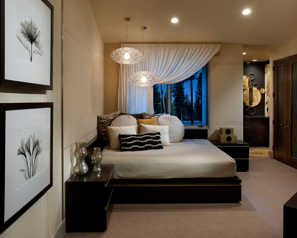 This is an example of a large contemporary guest bedroom in Sacramento with beige walls, carpet and beige floor.