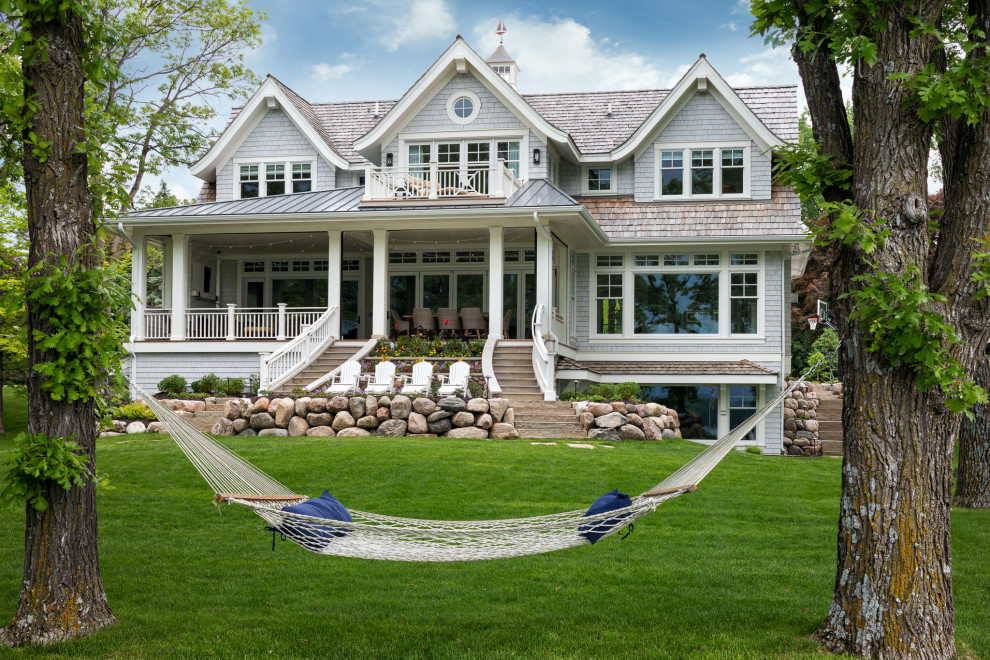 Beach style gray three-story wood and shingle gable roof photo in Minneapolis with a shingle roof and a brown roof