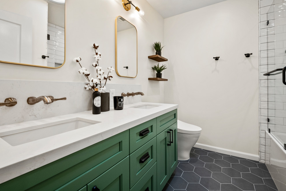 Design ideas for a large kids bathroom in San Francisco with shaker cabinets, green cabinets, an alcove tub, a shower/bathtub combo, a one-piece toilet, white tile, porcelain tile, white walls, porcelain floors, an undermount sink, quartzite benchtops, a sliding shower screen, white benchtops, a niche, a double vanity, a built-in vanity and black floor.