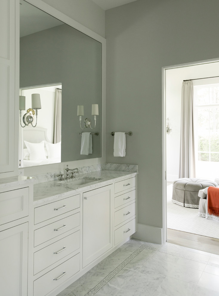 This is an example of a traditional master bathroom in Houston with flat-panel cabinets, white cabinets, grey walls and an undermount sink.