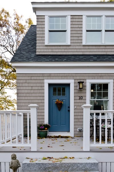 Inspiration for a large traditional two-storey grey exterior in Boston with wood siding and a gable roof.