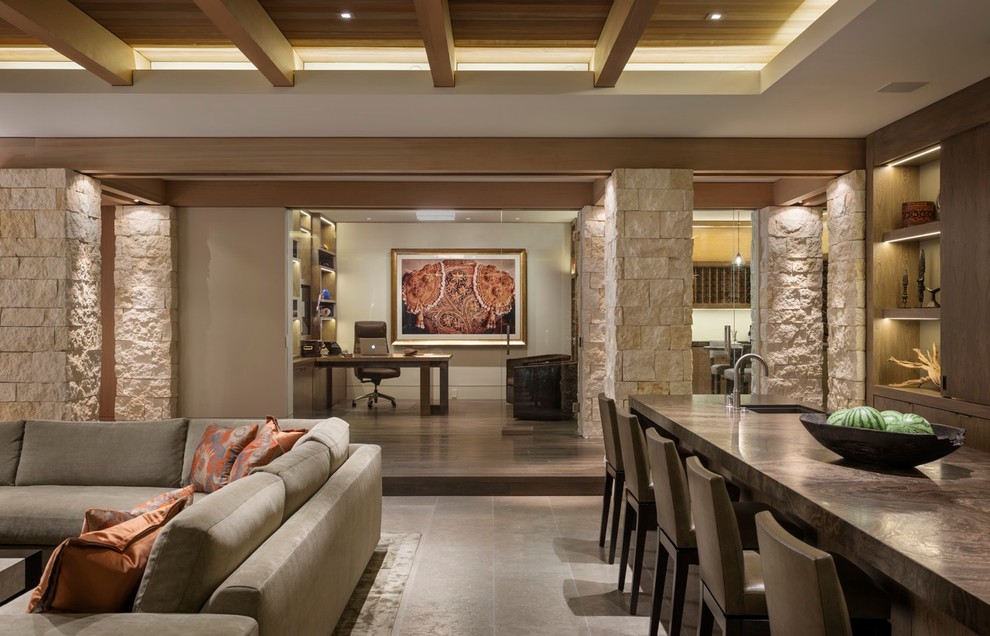 Photo of a contemporary open concept family room in Orange County with beige walls.