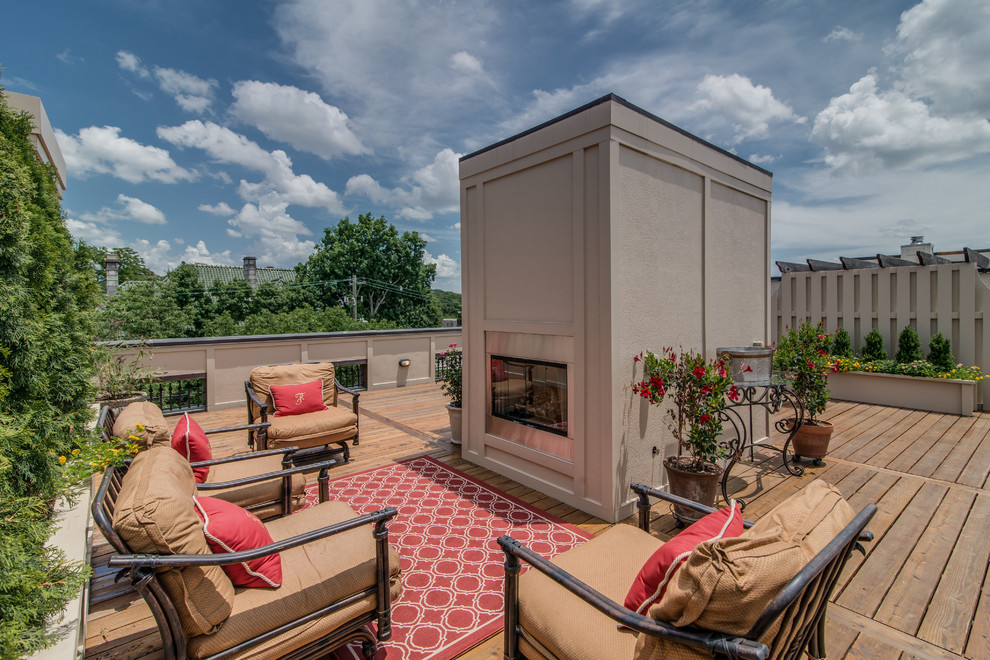 Photo of a large traditional rooftop and rooftop deck in Nashville with a fire feature and no cover.