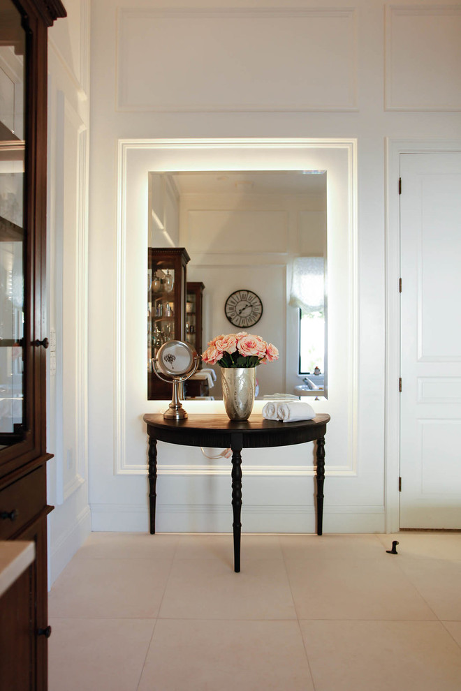 Example of a huge transitional master limestone floor freestanding bathtub design in Phoenix with white walls