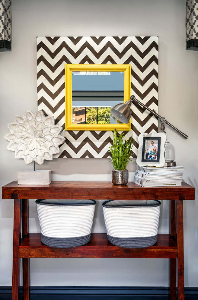 Example of a large transitional dark wood floor hallway design in Phoenix with gray walls