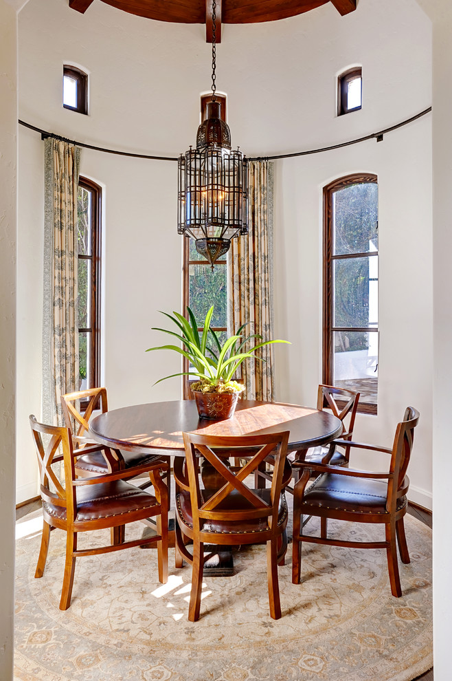Inspiration for a mediterranean separate dining room in Los Angeles with white walls.