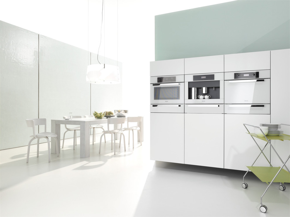Photo of a contemporary eat-in kitchen in Other with white appliances.