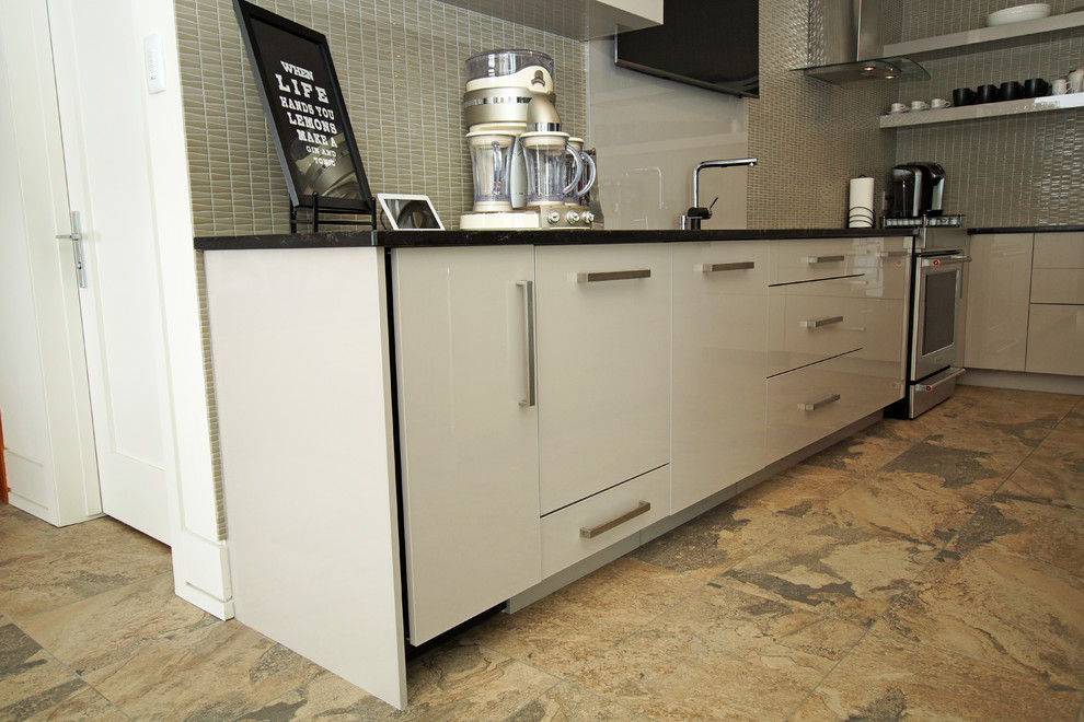 Inspiration for a large modern l-shaped kitchen in Other with an undermount sink, flat-panel cabinets, grey cabinets, quartz benchtops, grey splashback, stone slab splashback and black benchtop.
