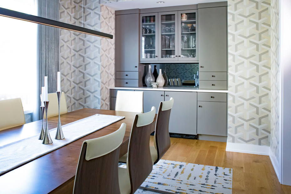 Inspiration for a large contemporary separate dining room in Chicago with grey walls and light hardwood floors.