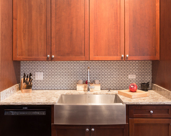 Inspiration for a mid-sized contemporary galley medium tone wood floor enclosed kitchen remodel in Chicago with an undermount sink, flat-panel cabinets, medium tone wood cabinets, granite countertops, white backsplash, cement tile backsplash, stainless steel appliances and an island