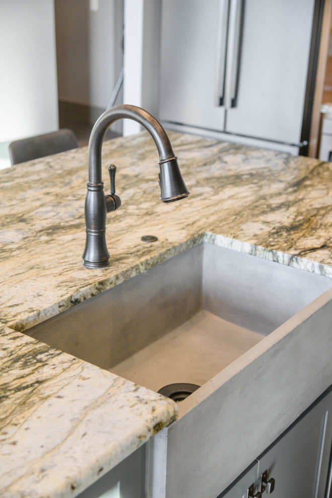 Transitional kitchen photo with stainless steel appliances and multicolored countertops