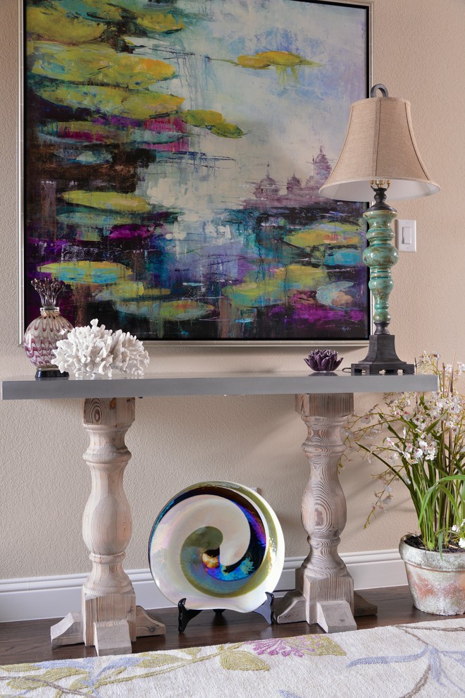 Example of a transitional foyer design in Dallas with beige walls