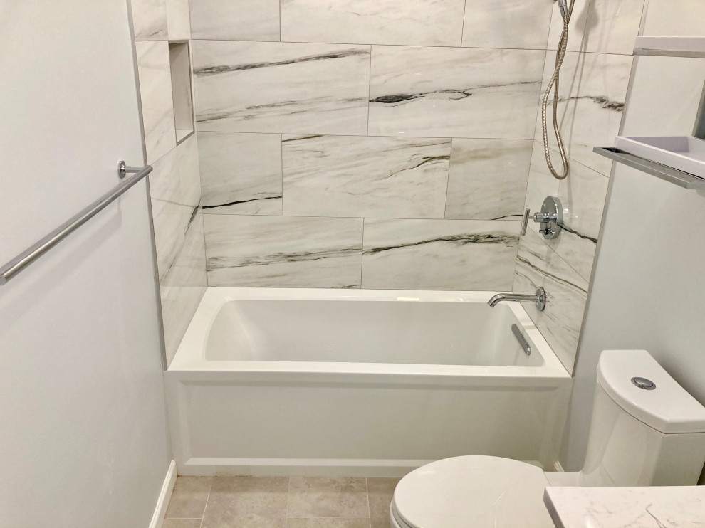 Example of a mid-sized minimalist master white tile and porcelain tile porcelain tile, gray floor and single-sink bathroom design in DC Metro with flat-panel cabinets, gray cabinets, a two-piece toilet, gray walls, an undermount sink, quartzite countertops, white countertops and a floating vanity