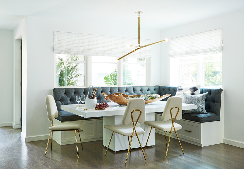 Mid-sized transitional medium tone wood floor kitchen/dining room combo photo in Dallas with white walls and no fireplace