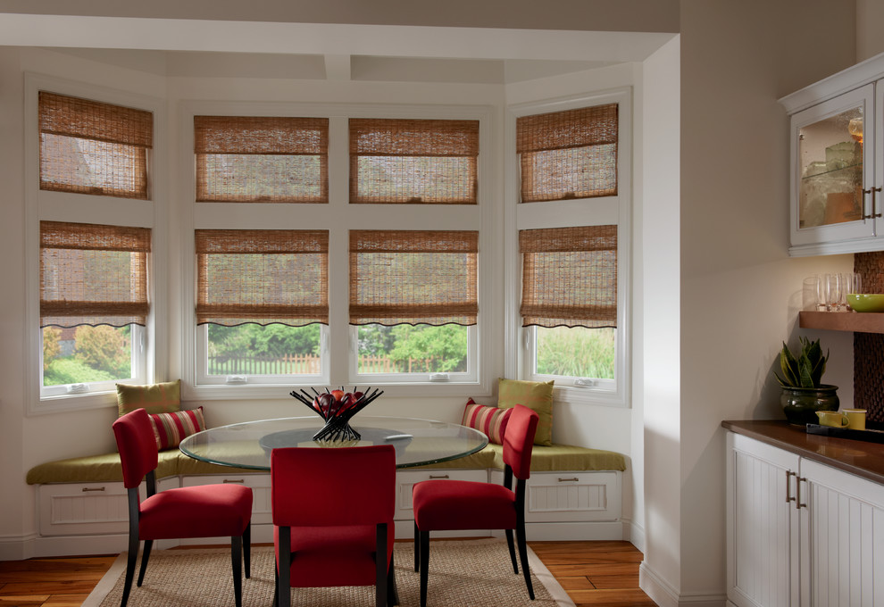 Mid-sized transitional medium tone wood floor kitchen/dining room combo photo with beige walls and no fireplace
