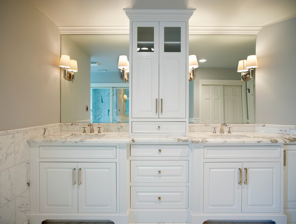 Example of a mid-sized transitional master black and white tile and stone tile alcove shower design with raised-panel cabinets, white cabinets, gray walls, an undermount sink and marble countertops