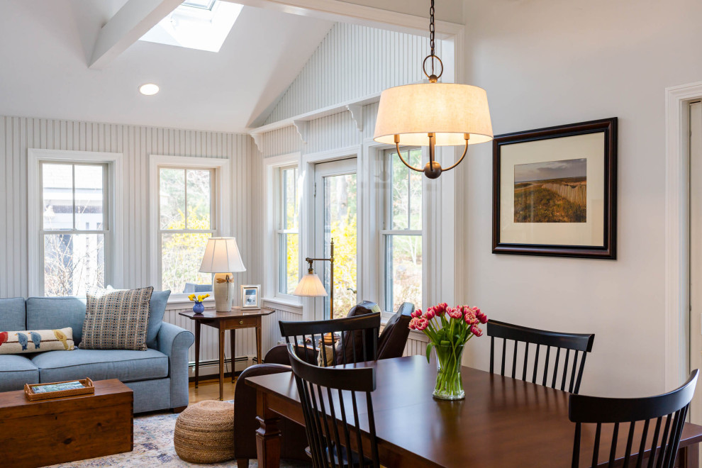 Inspiration for a mid-sized coastal medium tone wood floor and vaulted ceiling family room remodel in Boston