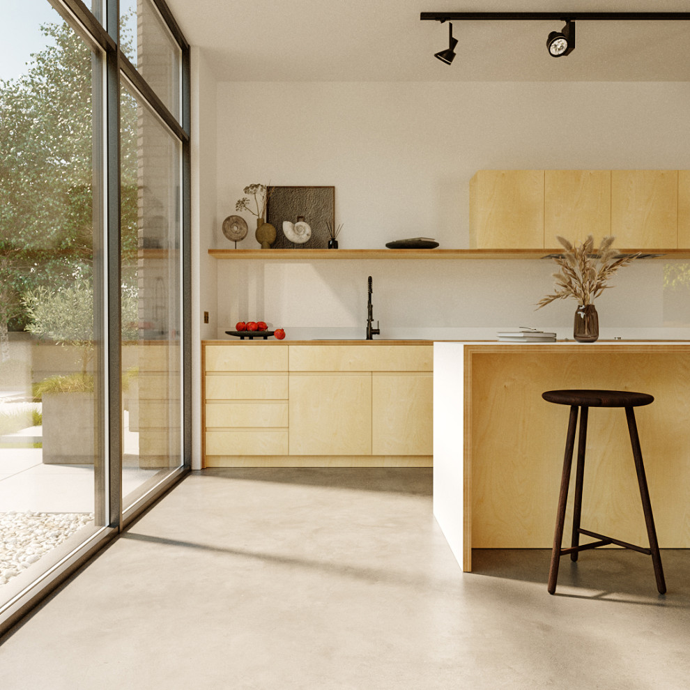 Modelo de cocina escandinava, de tamaño medio, abierta, con fregadero de doble seno, armarios con paneles lisos, puertas de armario de madera clara, encimera de laminado, salpicadero blanco, salpicadero de vidrio templado, electrodomésticos negros, suelo de cemento, una isla, suelo gris y encimeras blancas