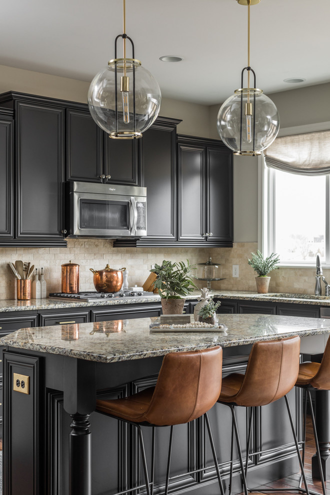 This is an example of a large transitional eat-in kitchen in Indianapolis with an undermount sink, black cabinets, beige splashback, stainless steel appliances, with island, brown floor, stone tile splashback, dark hardwood floors, grey benchtop and recessed-panel cabinets.