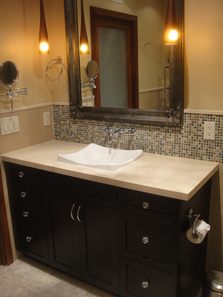 Small modern 3/4 bathroom in San Diego with shaker cabinets, dark wood cabinets, a curbless shower, a two-piece toilet, blue tile, matchstick tile, beige walls, porcelain floors, a drop-in sink and solid surface benchtops.