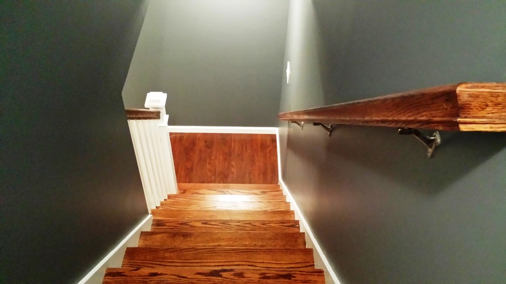 Mid-sized transitional underground vinyl floor and brown floor basement photo with gray walls