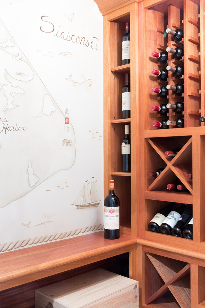 This is an example of a beach style wine cellar in Boston.