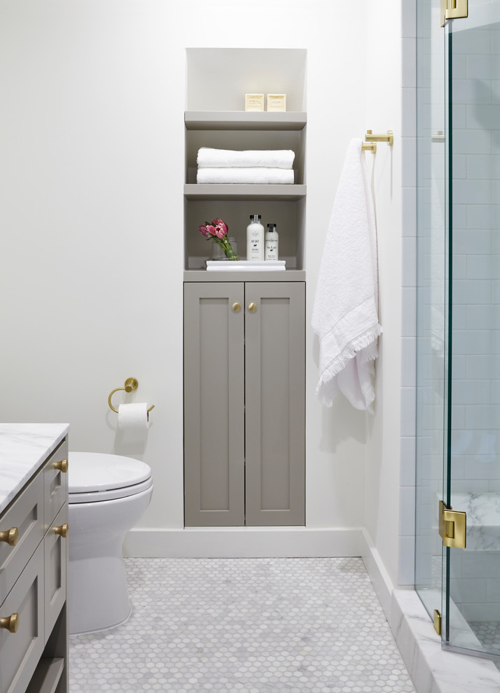 Inspiration for a mid-sized transitional 3/4 bathroom in Toronto with shaker cabinets, grey cabinets, an alcove shower, gray tile, marble, white walls, marble floors, a vessel sink, marble benchtops, grey floor, a hinged shower door and white benchtops.