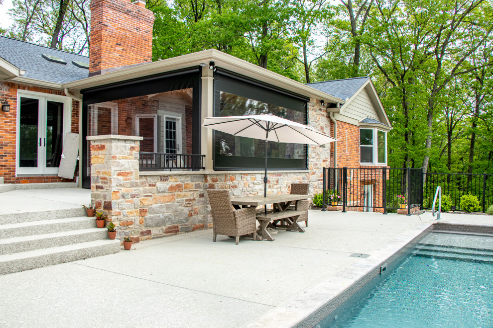 Covered Patio with an Outdoor Kitchen area and Fireplace Area Patio St Louis by Heartlands