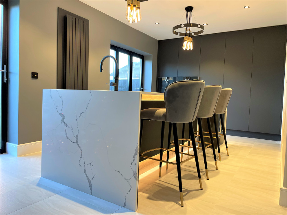 Example of a mid-sized trendy single-wall vinyl floor and gray floor open concept kitchen design in Other with a single-bowl sink, flat-panel cabinets, medium tone wood cabinets and an island