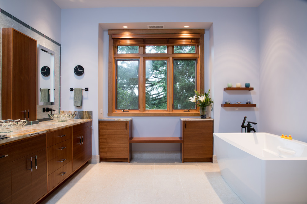 Photo of a large contemporary master bathroom in Seattle with flat-panel cabinets, dark wood cabinets, a freestanding tub, a curbless shower, a bidet, beige tile, glass tile, purple walls, porcelain floors, a vessel sink, quartzite benchtops, beige floor, a hinged shower door, blue benchtops, a double vanity, a built-in vanity and a shower seat.