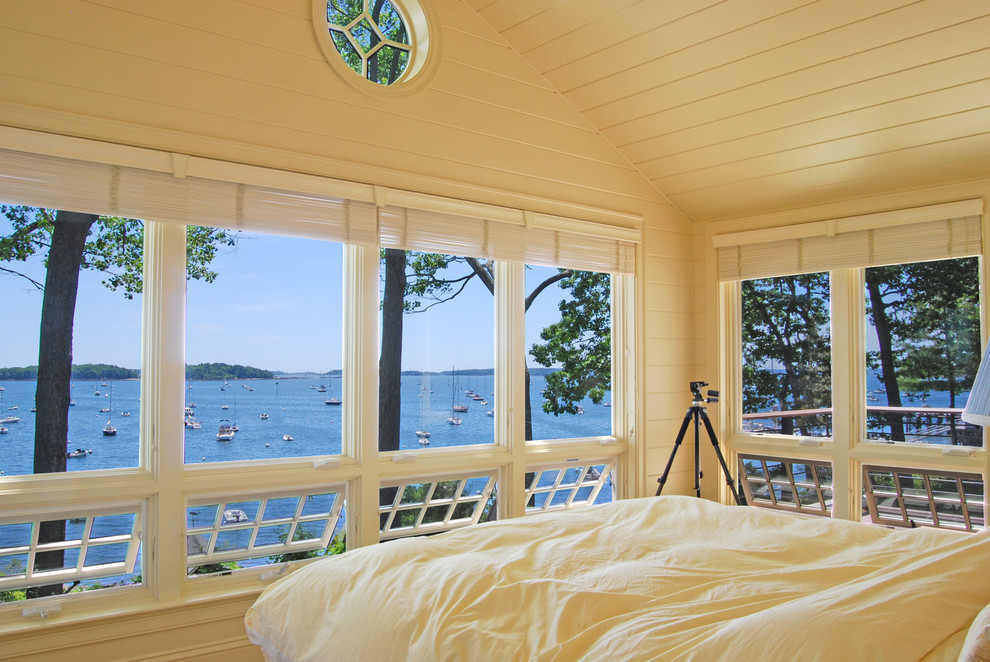 Inspiration for a traditional master bedroom in Portland Maine with white walls.