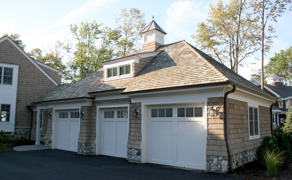 Photo of a large traditional attached garage in Grand Rapids.