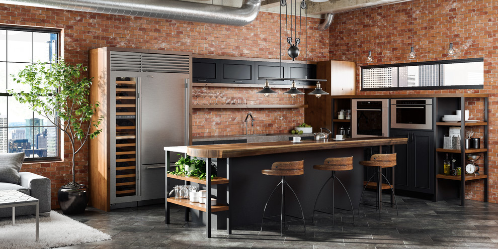 Photo of an industrial l-shaped open plan kitchen in Minneapolis with an integrated sink, black cabinets, wood benchtops, red splashback, brick splashback, stainless steel appliances, porcelain floors, with island and flat-panel cabinets.