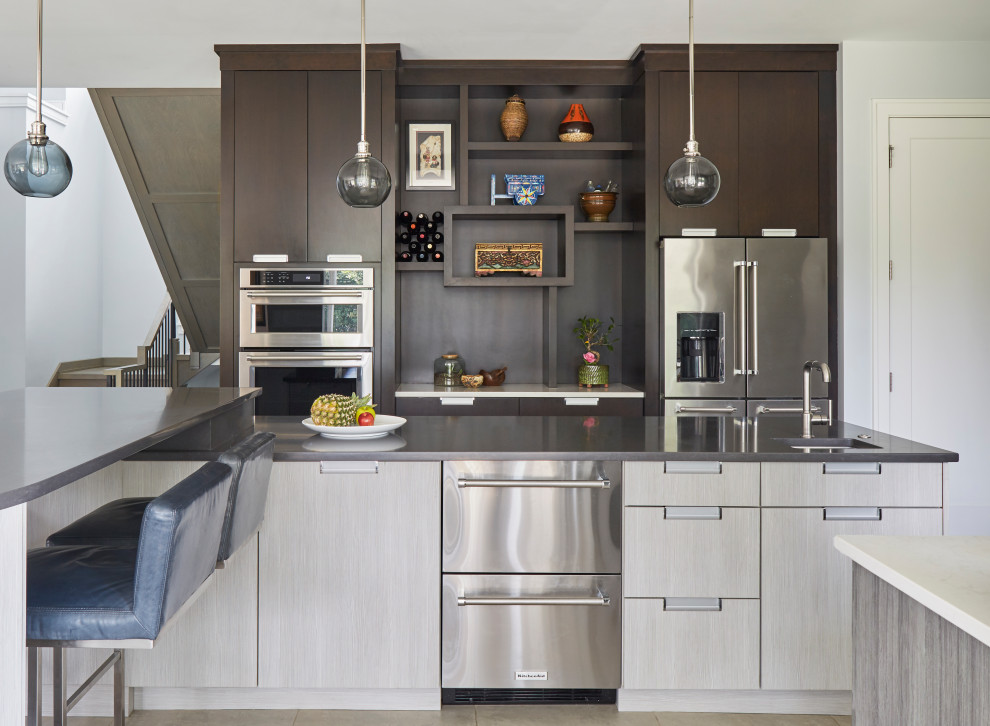 Inspiration for a mid-sized transitional u-shaped open plan kitchen in Chicago with an undermount sink, flat-panel cabinets, dark wood cabinets, quartz benchtops, grey splashback, ceramic splashback, stainless steel appliances, porcelain floors, with island, beige floor and brown benchtop.