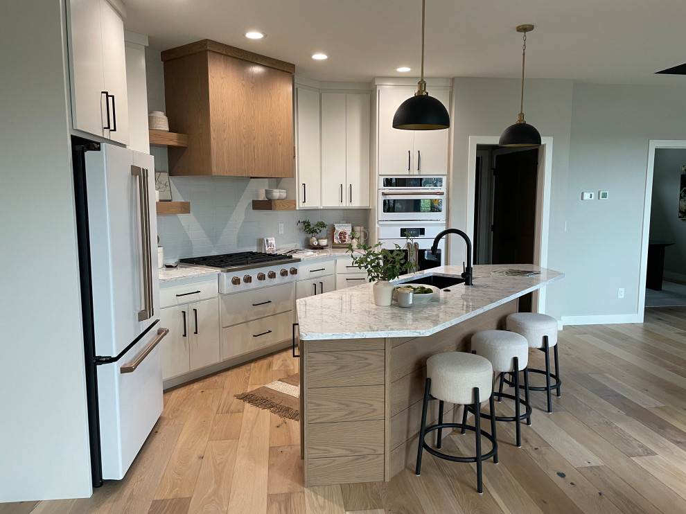 Danish kitchen photo with flat-panel cabinets and an island